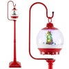Festive 68-inch red street lamp post with musical snow globe lantern featuring a Christmas scene and colorful lights.