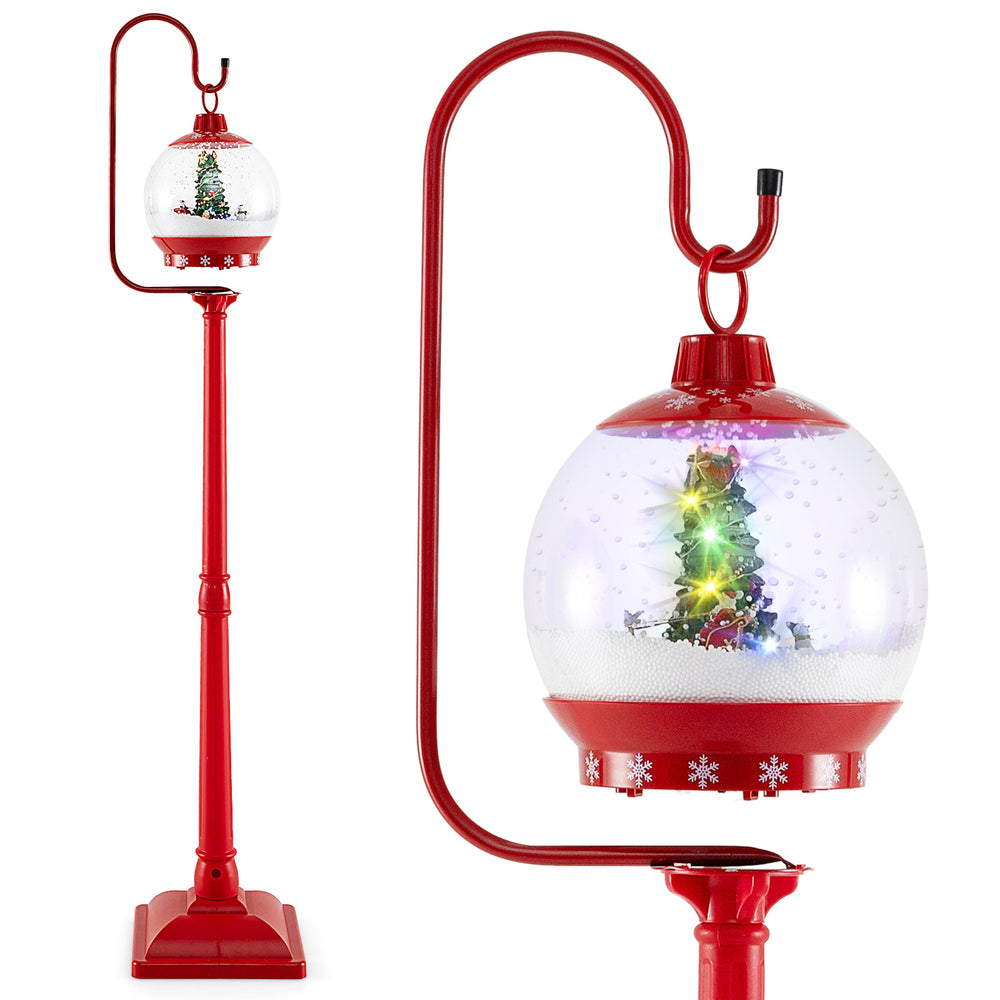 Festive 68-inch red street lamp post with musical snow globe lantern featuring a Christmas scene and colorful lights.