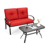 Loveseat with red cushions and a coffee table, made of durable steel, perfect for outdoor patio relaxation.