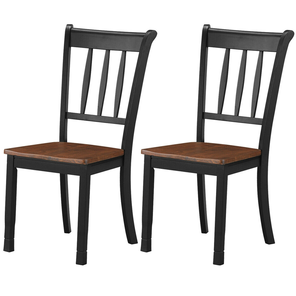 Set of 2 solid black spindle back dining chairs with rubber wood seats, ideal for dining rooms and kitchens.