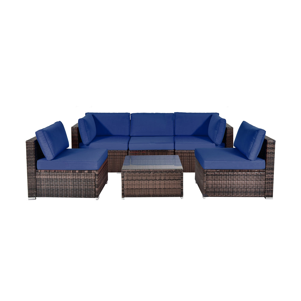 L-shaped patio rattan sofa set with navy cushions, featuring a sturdy design and glass coffee table for outdoor comfort.