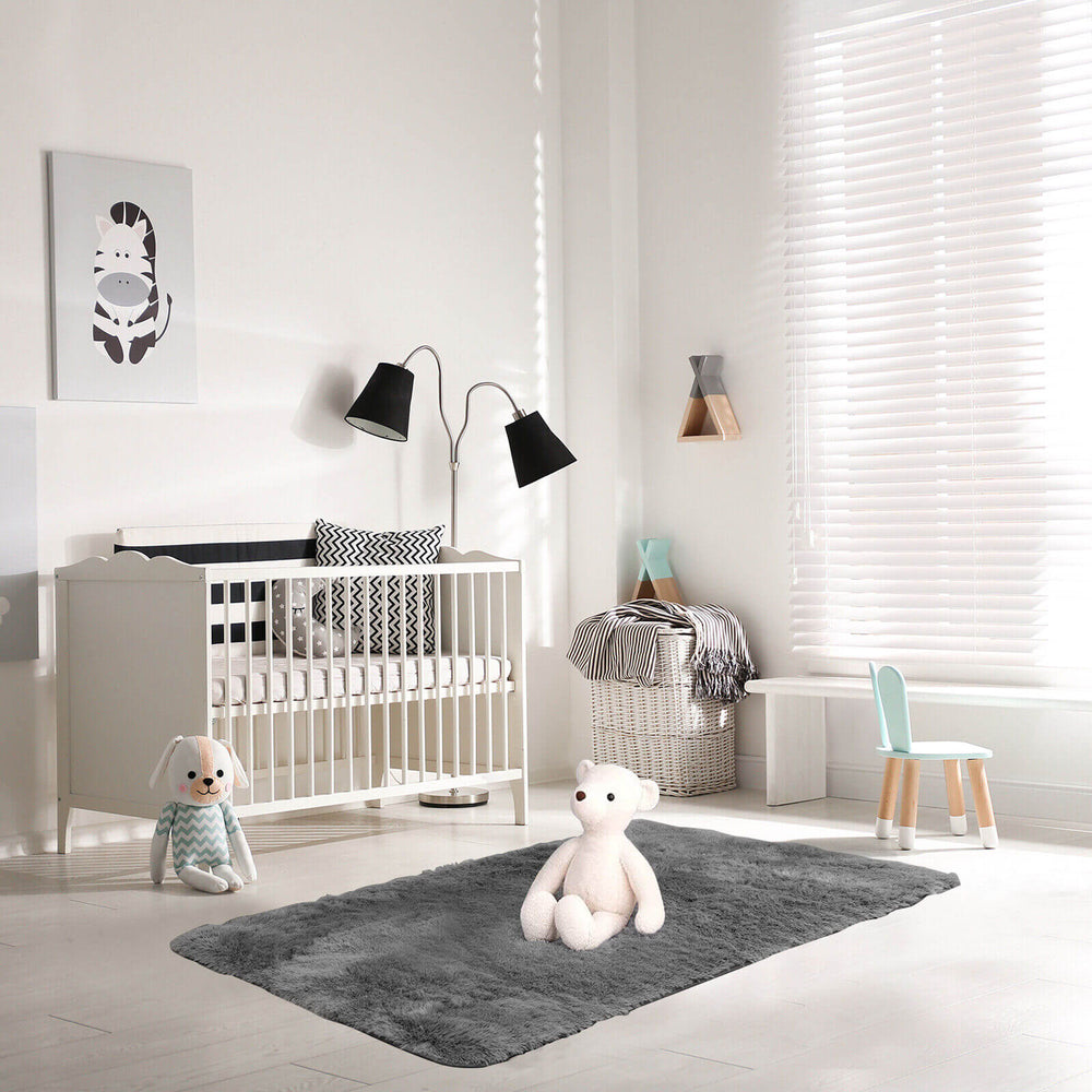 Modern 4x6 feet soft shag rug with non-slip grip dots, ideal for stylish decor in living rooms or bedrooms.