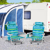 Two green foldable backpack beach chairs with cup holders and storage pockets, set up for outdoor relaxation.