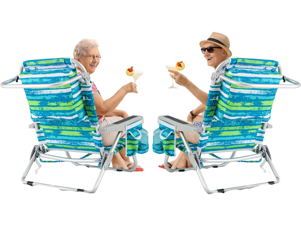 Two green foldable backpack beach chairs with cup holders on a sunny beach, perfect for relaxation and storage.