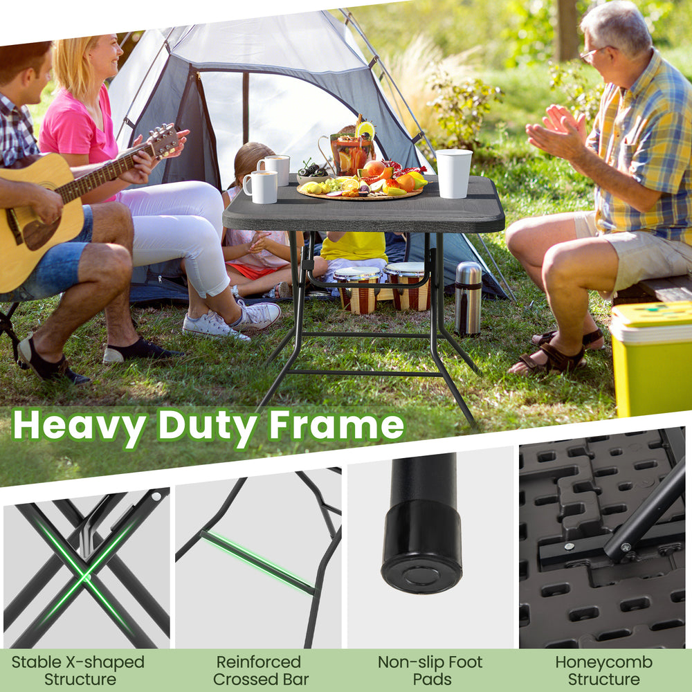 Foldable 2.6FT dining table with wood grain HDPE surface, heavy-duty frame, and non-slip foot pads for outdoor use.