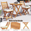 Folding chair table set featuring premium acacia wood, soft seat cushions, and slatted design for outdoor comfort.