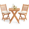 Folding chair table set in natural acacia wood with soft cushions, perfect for backyard or balcony relaxation.