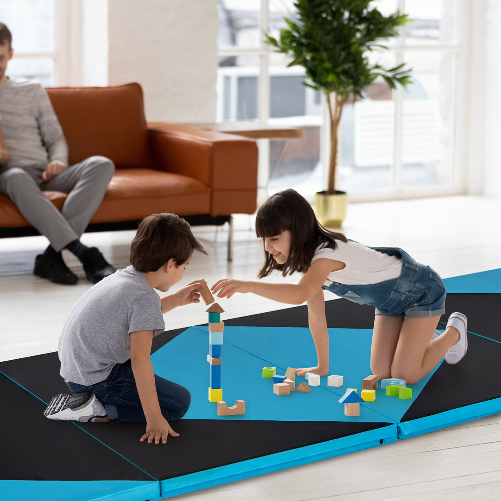 Children playing on a black and turquoise folding exercise gym mat, ideal for gymnastics and stretching activities.