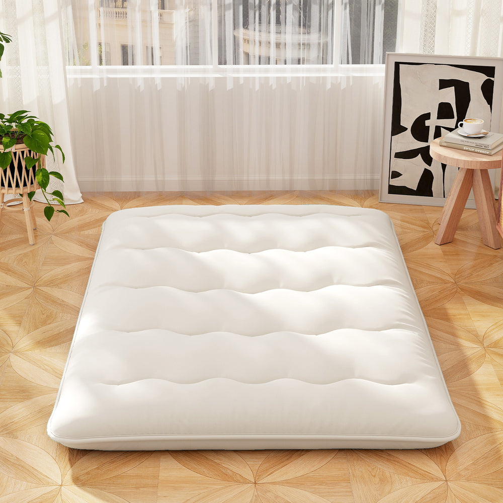 Beige full-size futon mattress floor sleeping pad with quilted design, ideal for camping, yoga, or kids' play.
