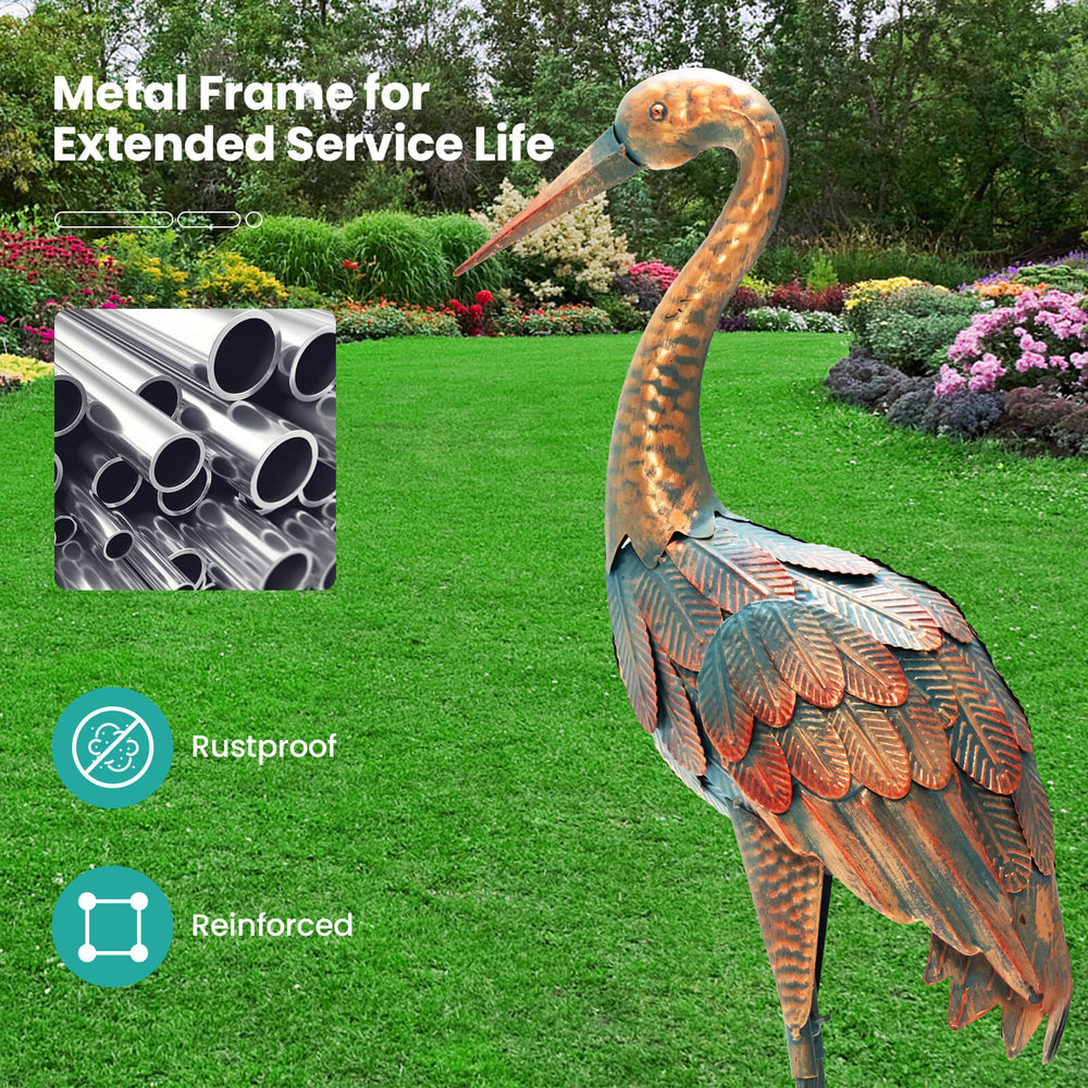 Standing metal crane statue with rustproof construction and detailed feathers, ideal for charming garden decoration.