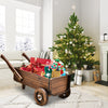 Wooden wagon planter box with wheels, rustic brown, perfect for displaying holiday decor or potted plants indoors.