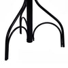 Close-up of the sturdy black metal base of a vintage coat hat tree stand with elegant design and six hooks.