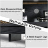 Close-up of cable management holes and stable support legs on a 58-inch black TV stand for organized storage.