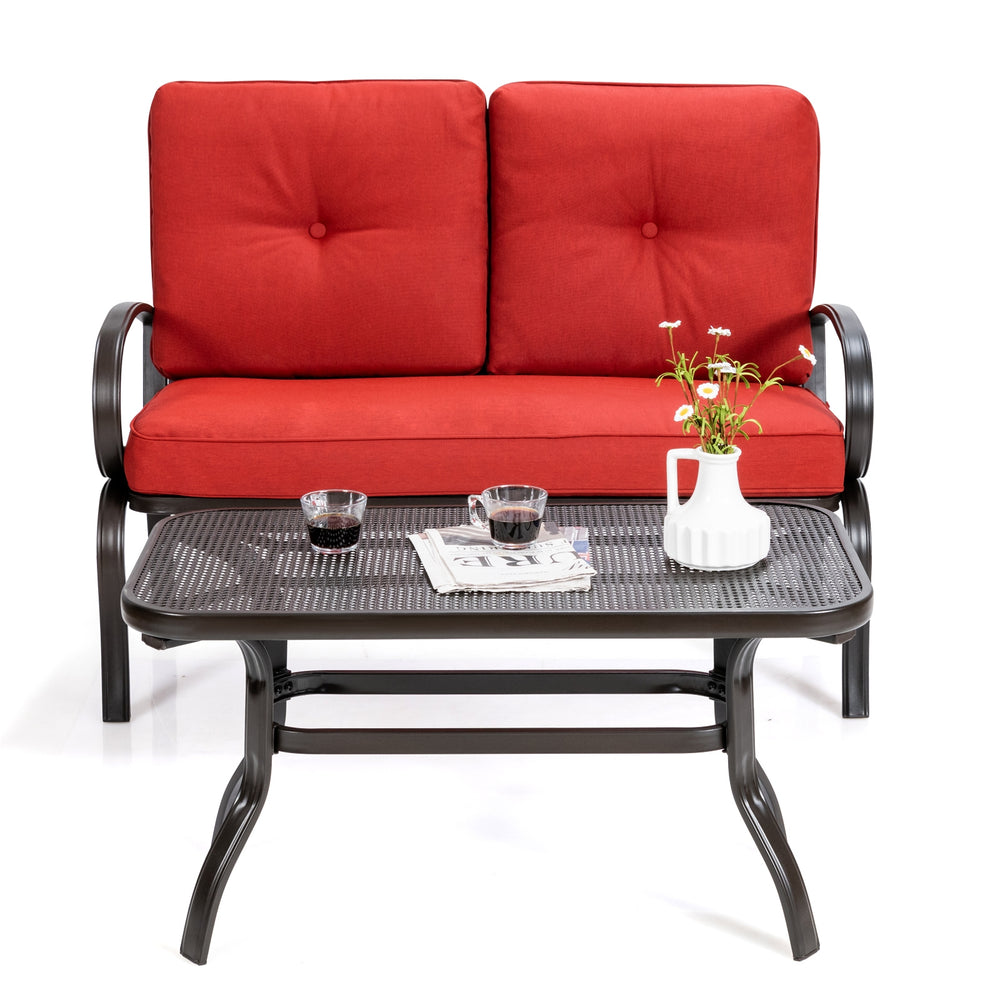 Loveseat with red cushions and a coffee table, made of durable steel, perfect for patio or garden relaxation.