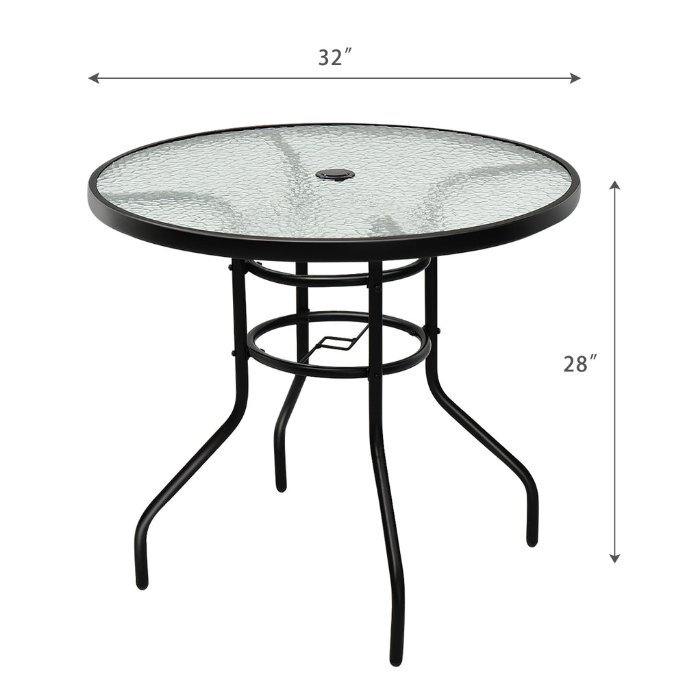 Round 32-inch patio table with tempered glass top and black steel frame, featuring an umbrella hole for outdoor use.