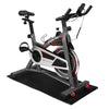 Stationary exercise bike on a high-density PVC mat, ideal for home gym use, protects floors and reduces noise.