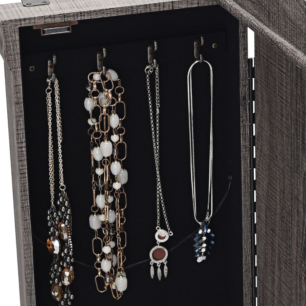 Jewelry cabinet storage organizer in gray with hooks for necklaces, featuring spacious drawers and a top mirror for.