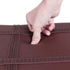 Close-up of the brown PU leather surface of the Solid Wood Piano Bench, showcasing its padded texture and durable.
