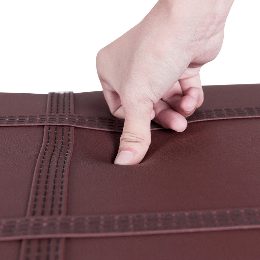 Close-up of the brown PU leather surface of the Solid Wood Piano Bench, showcasing its padded texture and durable.