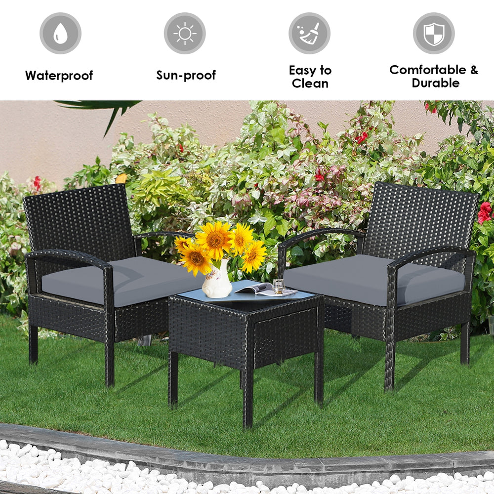 Three-piece outdoor rattan patio conversation set with gray cushions, perfect for backyard relaxation and easy cleaning.