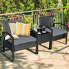 Two-piece outdoor rattan patio conversation set with gray cushions and a glass table, perfect for backyard relaxation.
