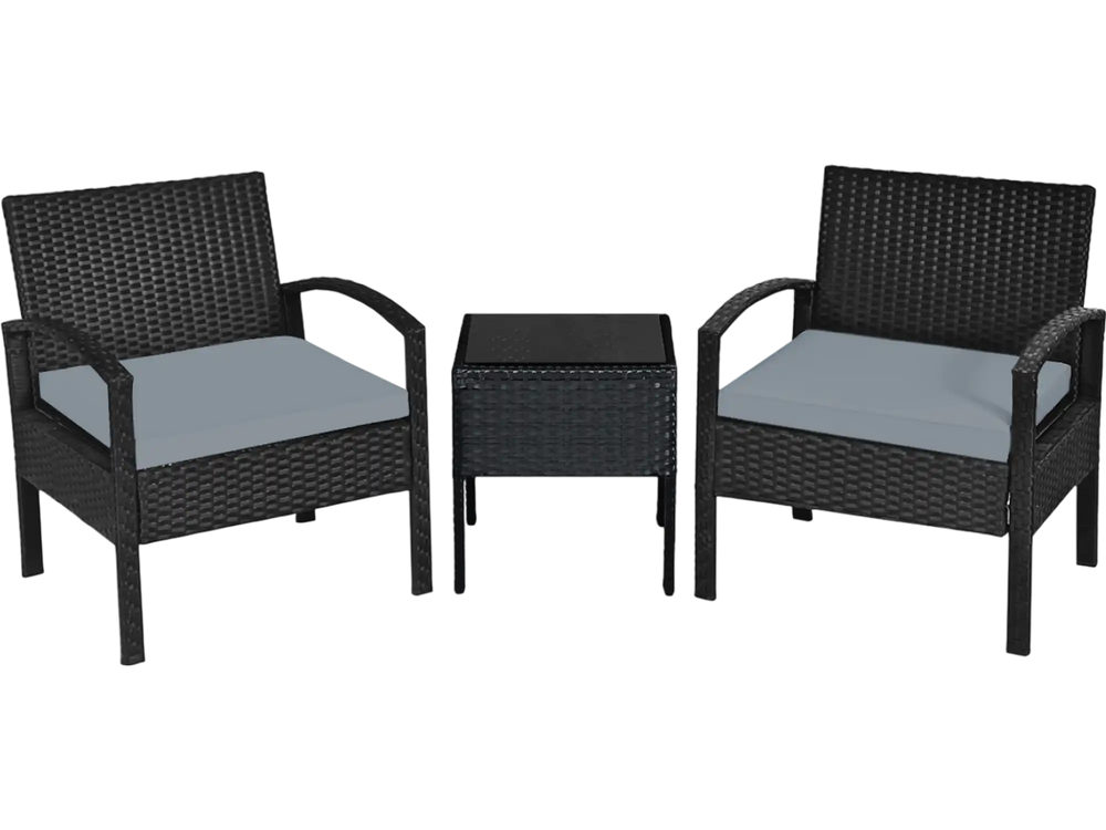 Two black rattan chairs with gray cushions and a matching table, perfect for outdoor patio relaxation.