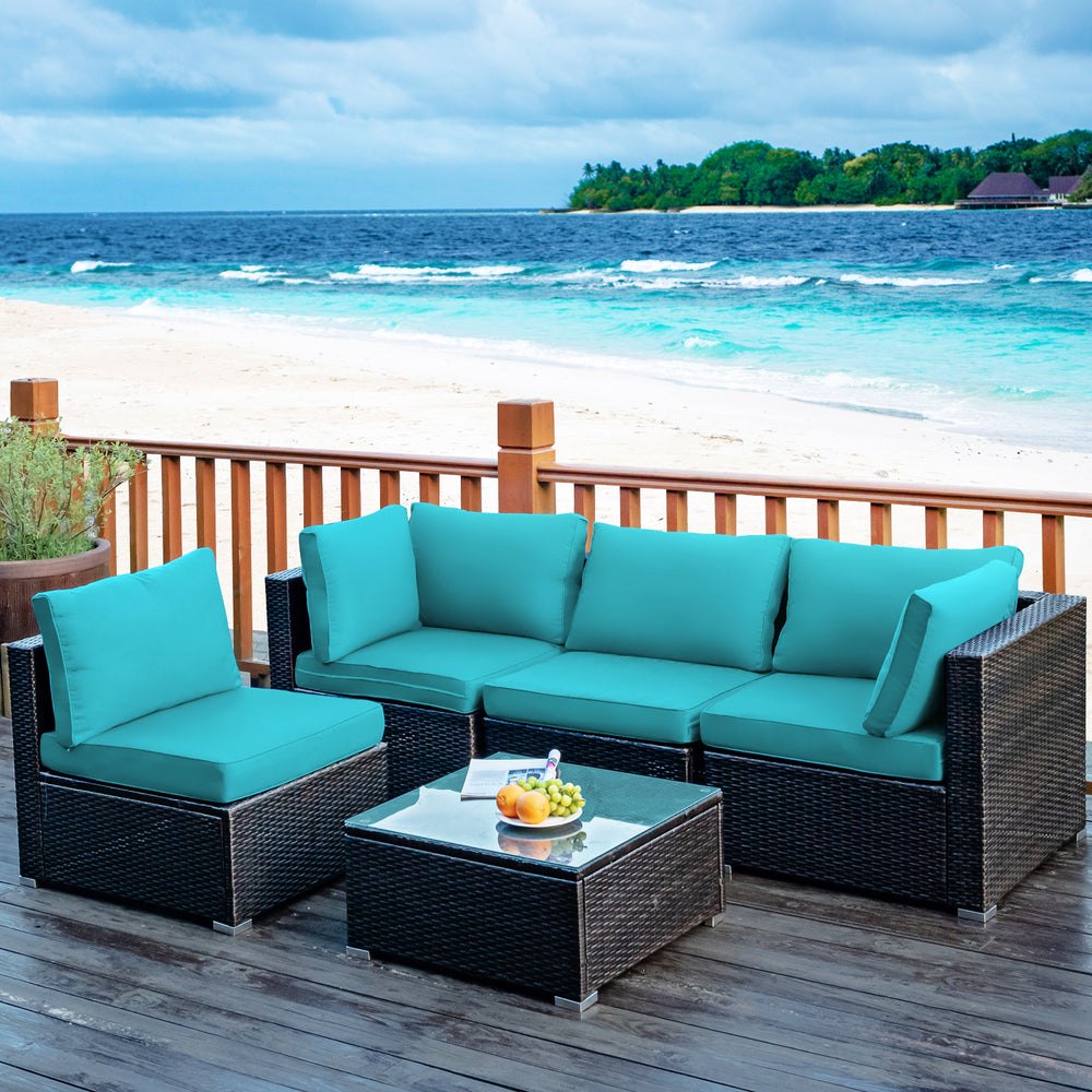 Turquoise cushion detail on a corner sofa from the 5-piece patio rattan furniture set, designed for ultimate comfort.