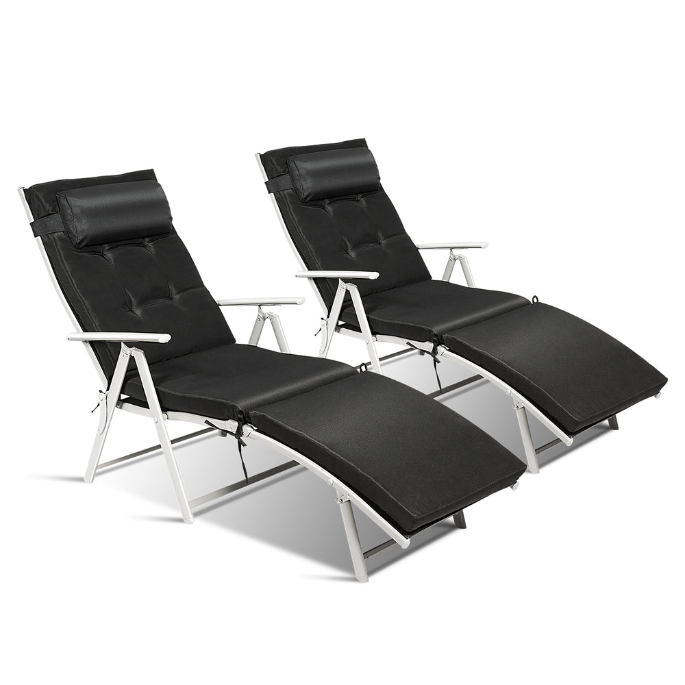Adjustable black folding chaise lounge chairs with removable pillows, perfect for outdoor relaxation and easy storage.