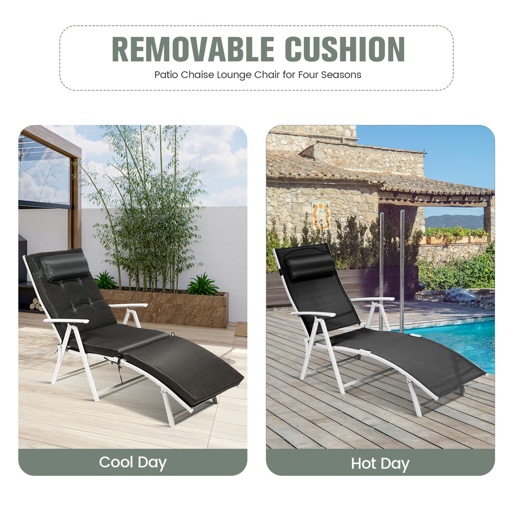 Adjustable black folding chaise lounge chair with removable cushion and pillow, ideal for outdoor relaxation by the.