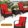 Curved design rattan chair set with red cushions and glass top coffee table, perfect for outdoor patio relaxation.