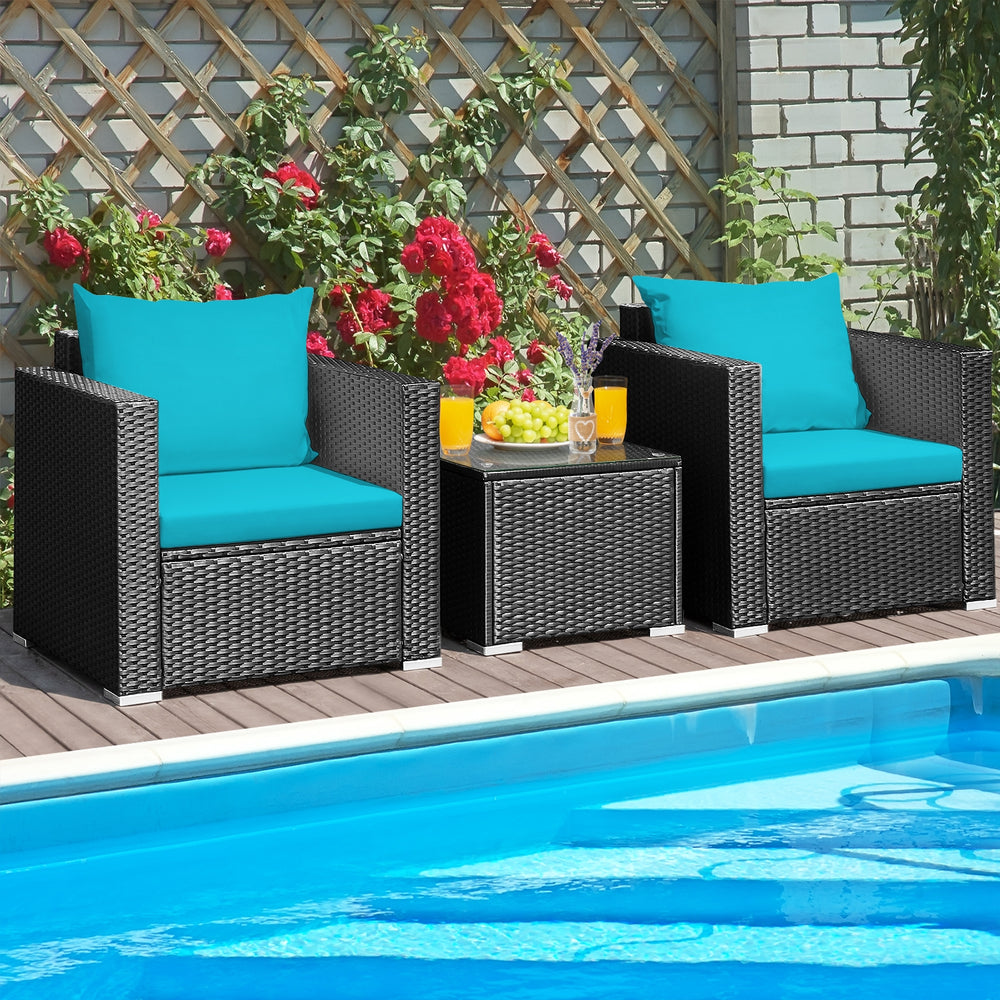 3-piece patio wicker conversation set with turquoise cushions, featuring a glass-top table, perfect for outdoor.