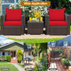 Patio conversation set featuring red cushions, sturdy rattan, and a glass-top table, ideal for outdoor relaxation.