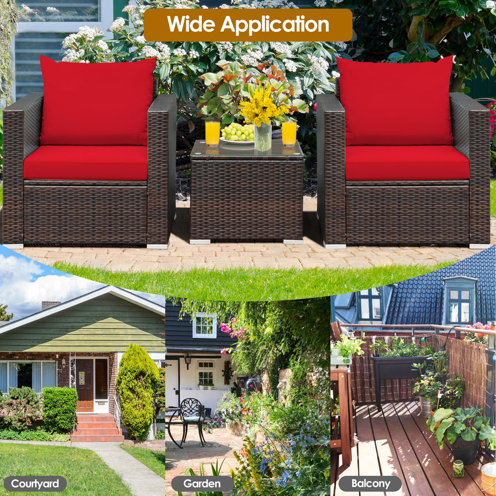 Patio conversation set featuring red cushions, sturdy rattan, and a glass-top table, ideal for outdoor relaxation.
