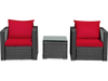 Two red-cushioned rattan chairs and a glass-top table, perfect for outdoor patio relaxation.