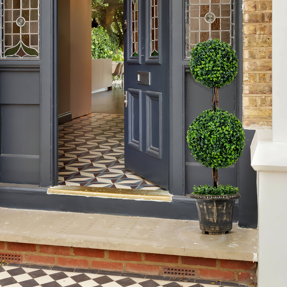 Artificial 36-inch double ball tree with UV protection, placed at an entrance for a touch of greenery and stability.