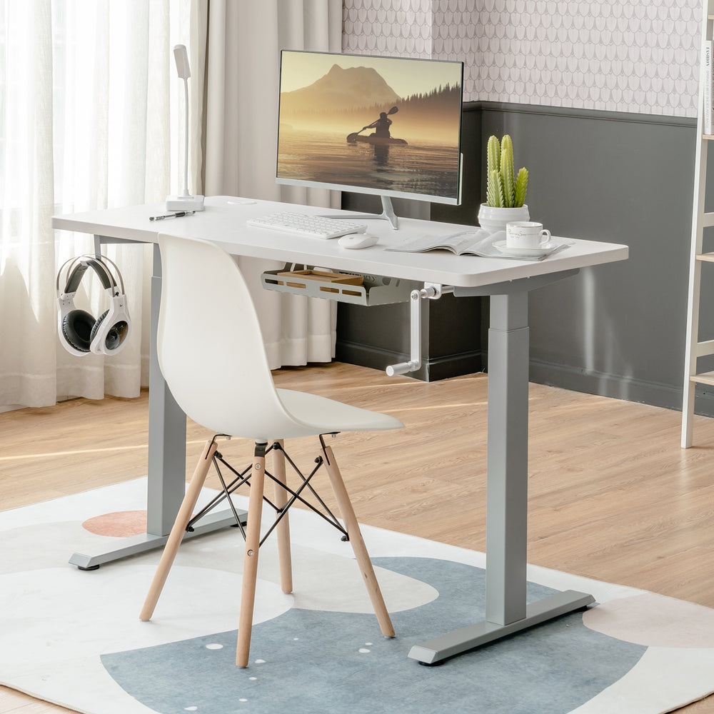 Height adjustable hand crank sit to stand desk frame in gray, designed for ergonomic work posture and cable management.