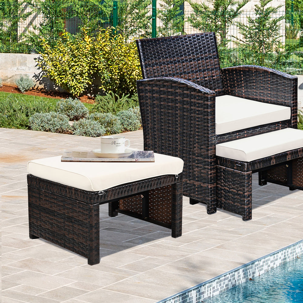 Patio rattan ottoman with soft cushion, durable PE rattan, perfect for outdoor use by the poolside or garden.