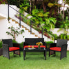 Four-piece patio rattan furniture set with red cushions, featuring a loveseat, two chairs, and a tempered glass coffee.