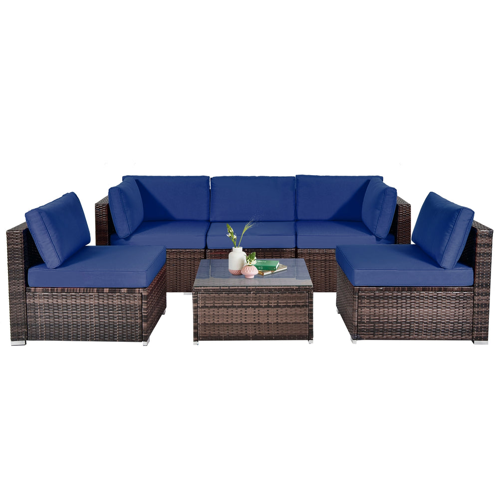 6-piece patio rattan furniture set with navy cushions and glass coffee table, ideal for outdoor relaxation.