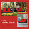 2-person patio rattan swing with red cushions, featuring sturdy steel chains for safe outdoor relaxation.