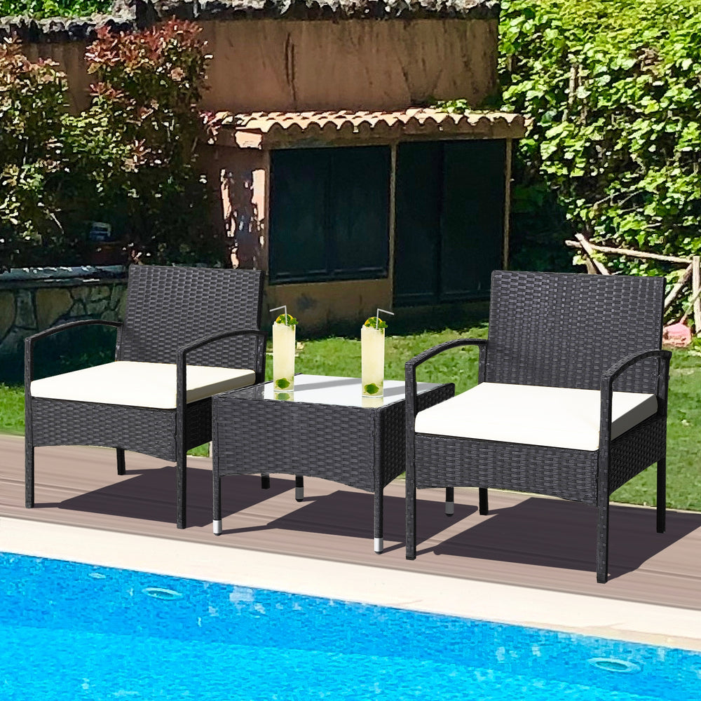 3 pieces patio wicker rattan furniture set with cushions, featuring a coffee table and ideal for outdoor relaxation by.