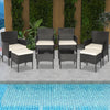Patio wicker conversation set featuring 4 chairs, 2 ottomans, and 2 coffee tables, perfect for poolside relaxation.