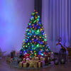 5 ft artificial Christmas tree with colorful pre-lit LED lights, surrounded by gifts and festive decorations for.