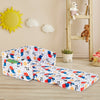 Convertible kids sofa in white velvet with cartoon pattern, designed for lounging or sleeping, ideal for playrooms.