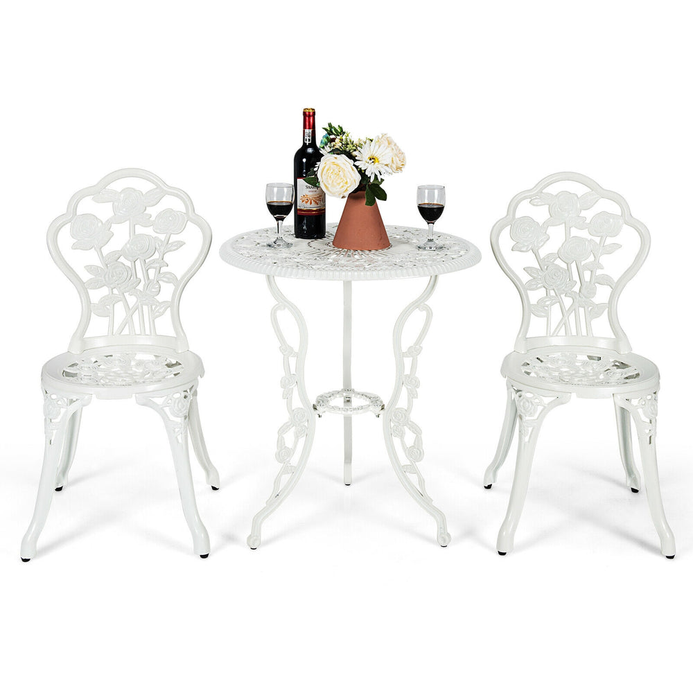 White outdoor cast aluminum patio furniture set with rose design, featuring a table and two chairs for elegant outdoor.