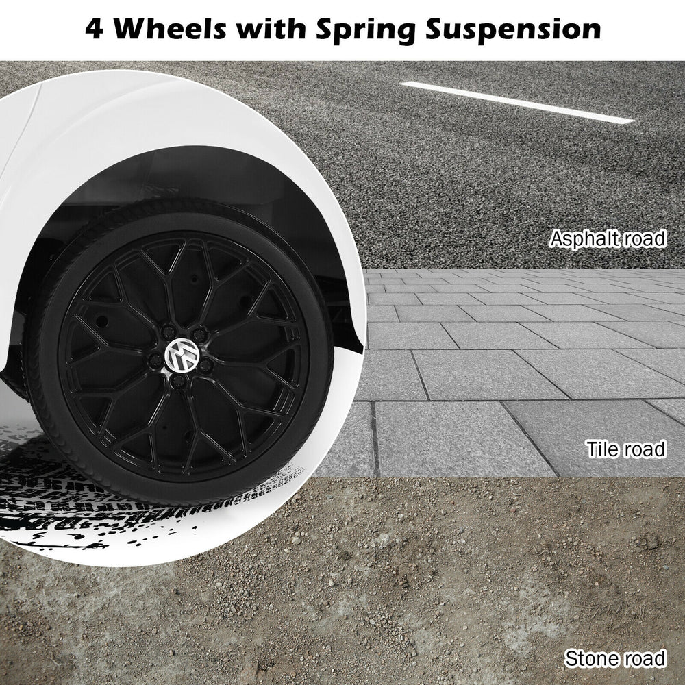 Close-up of the Volkswagen Beetle kids electric ride on car wheel showcasing 4 wheels with spring suspension for smooth.