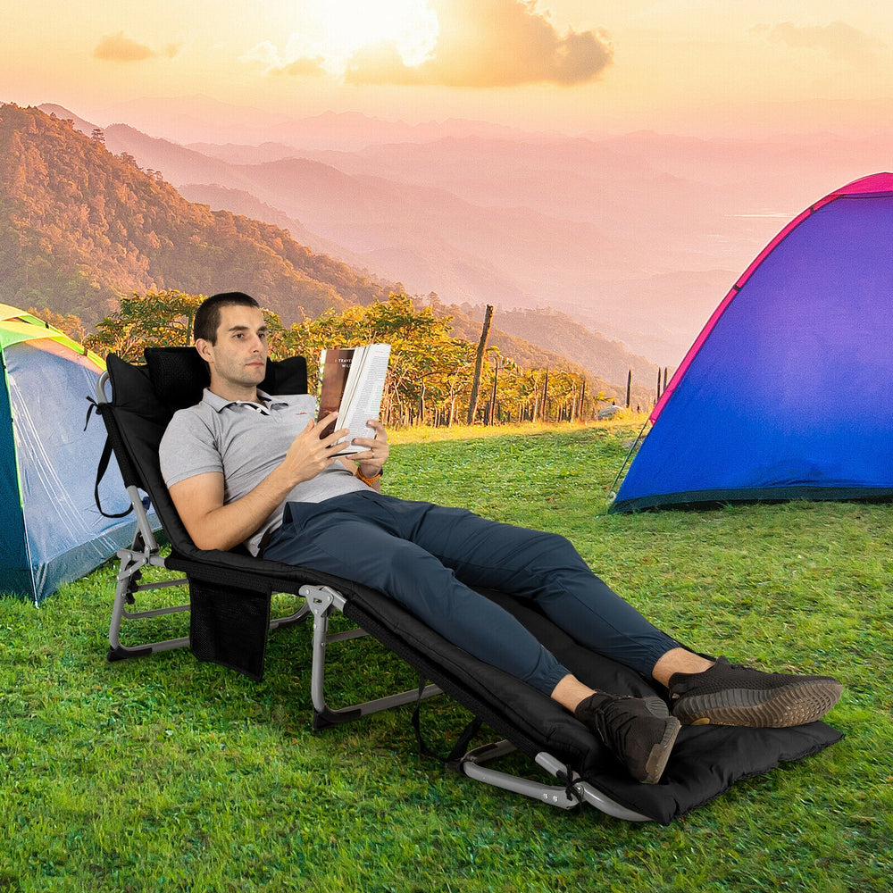Oversized black folding lounge chair with removable mattress, perfect for outdoor relaxation at the beach or garden.