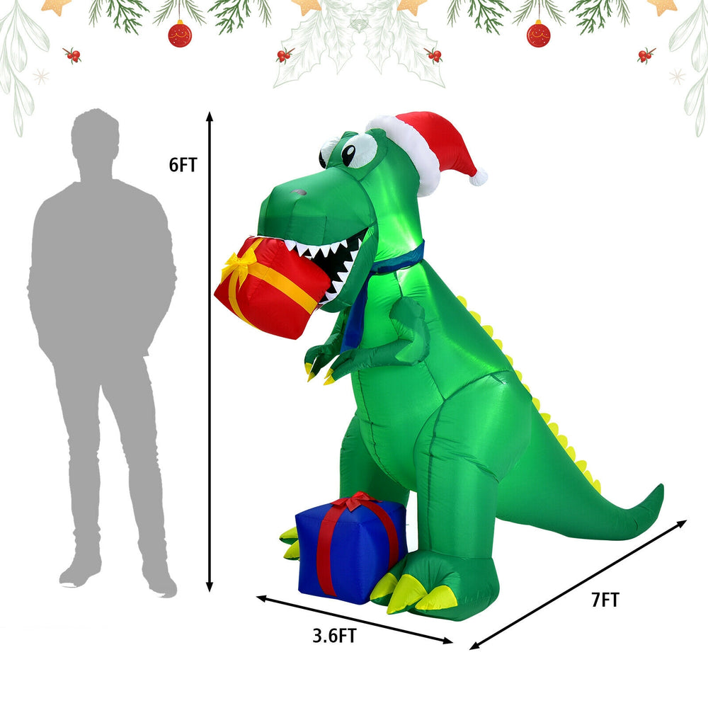 Inflatable 6ft Christmas dinosaur wearing a Santa hat, holding gifts, perfect for indoor and outdoor holiday decor.