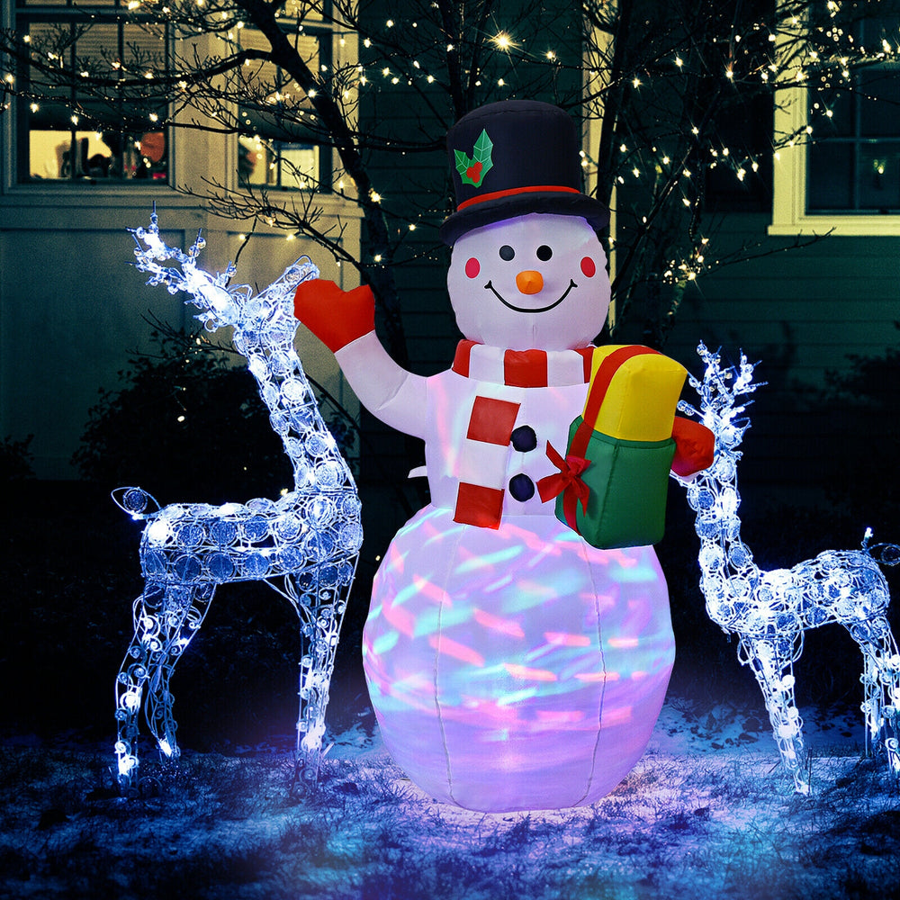 5-foot tall inflatable snowman with colorful LED lights, surrounded by light-up reindeer, creating a festive outdoor.