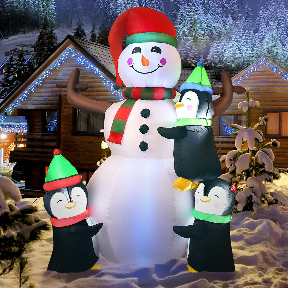 6ft inflatable Christmas snowman with penguins, bright lights, perfect for outdoor holiday decoration in the yard.